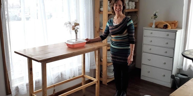 Yvette Egan stands in her workspace in Madison, Wisconsin. She's the owner of the Etsy shop known as ParkwoodTreasures, which sells vintage Pyrex bowls in mint condition.