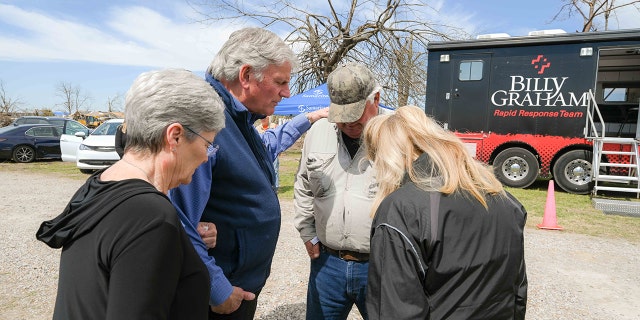 Rev. Franklin Graham in prayer in Mississippi as Samaritan's Purse helps those suffering from a devastating tornado earlier in the week. 