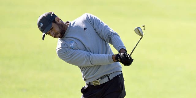 Aaron Rai of England plays his shot on the fourth green of the South Course during the second round of the Farmers Insurance Open at Torrey Pines Golf Course on January 26, 2023 in La Jolla, California. 