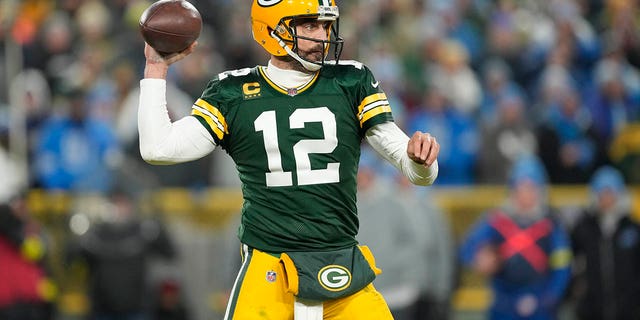 Aaron Rodgers of the Green Bay Packers looks to throw a pass against the Detroit Lions at Lambeau Field Jan. 8, 2023, in Green Bay, Wis. 