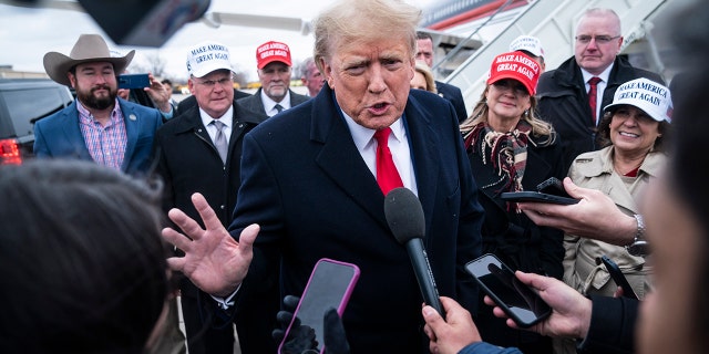 Trump speaking with reporters