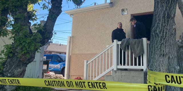 Police stand at the scene of an overnight fire that severely damaged a building that was being renovated to house a new abortion clinic in Casper, Wyoming, on May 25, 2022. A judge plans to hear arguments on whether abortions should resume in the state.