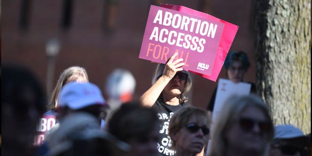 A pistillate holds a motion during an termination rights rally successful Annapolis, Maryland, connected June 24, 2022. In 2024, Maryland voters volition determine whether to enshrine the close to termination successful the state's constitution.