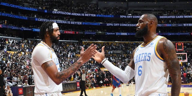 LeBron James (6) and Anthony Davis (3) give a high five for the Los Angeles Lakers after a game against the Denver Nuggets on October 30, 2022 at Crypto.Com Arena in Los Angeles.