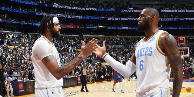 LeBron James (6) and Anthony Davis (3) of the Los Angeles Lakers high-five after a game against the Denver Nuggets Oct. 30, 2022, at Crypto.Com Arena in Los Angeles.
