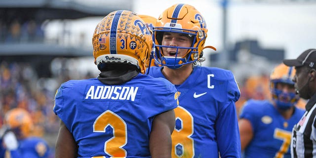 Jordan Addison of the Pittsburgh Panthers celebrates with Kenny Pickett (8) after a 23-yard touchdown run in the second quarter against the Clemson Tigers at Heinz Field on October 23, 2021 in Pittsburgh. 