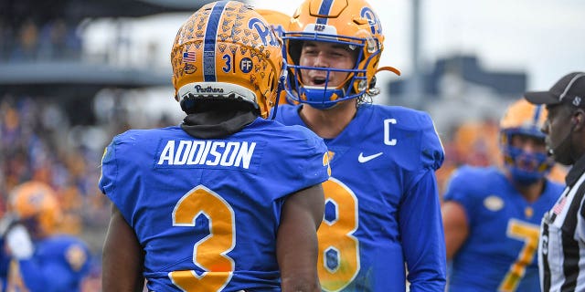 Jordan Addison of the Pittsburgh Panthers celebrates with Kenny Pickett (8) after a 23-yard touchdown run in the second quarter against the Clemson Tigers at Heinz Field on October 23, 2021 in Pittsburgh. 