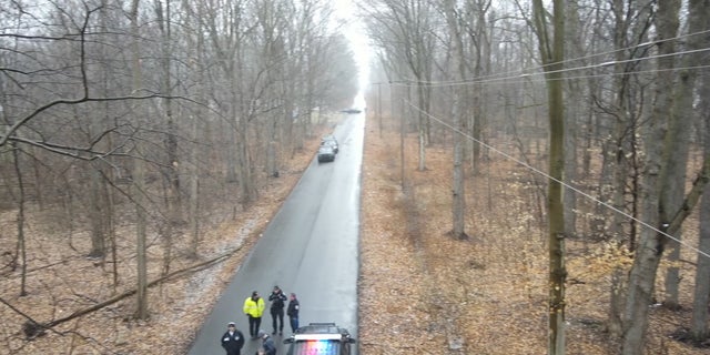 Akron, Ohio, police investigate after two bodies were found bound, gagged and executed in a secluded wooded area.