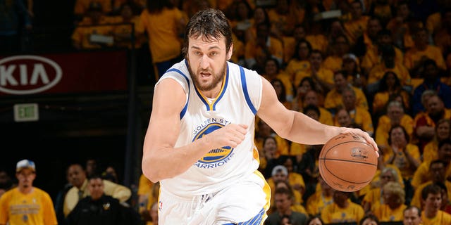 Andrew Bogut #12 of the Golden State Warriors drives against the Houston Rockets in Game Two of the 2015 NBA Playoffs Western Conference Finals on May 21, 2015 at Oracle Arena in Oakland, California.