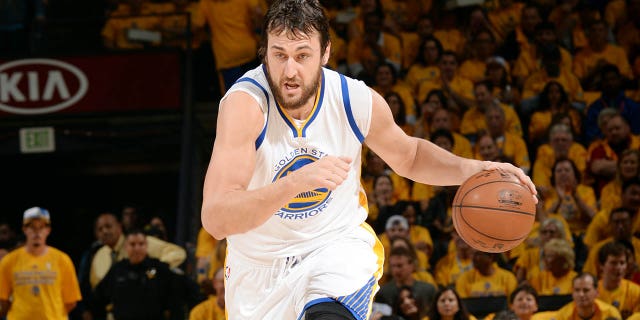 Andrew Bogut #12 of the Golden State Warriors drives against the Houston Rockets in Game Two of the 2015 NBA Playoffs Western Conference Finals on May 21, 2015 at Oracle Arena in Oakland, California.