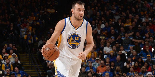 Andrew Bogut #12 of the Golden State Warriors dribbles the ball against the Milwaukee Bucks on December 18, 2015 at Oracle Arena in Oakland, California.