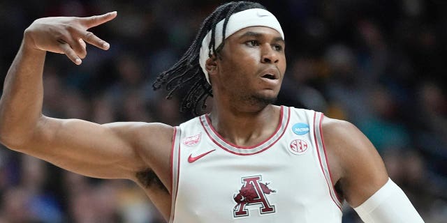 Arkansas's Ricky Council IV reacts to his three pointer during the first half of a first-round college basketball game in the NCAA Tournament Thursday, March 16, 2023, in Des Moines, Iowa.