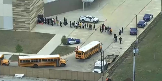 Students at Lamar High School in Arlington, Texas, were reunited with parents around 11 a.m. after police searched the school building.