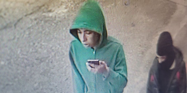 Police said the two suspects, pictured here, left Khudhair Hamdan in the road with a gunshot wound and fled with the car. Hamdan collapsed and later died.