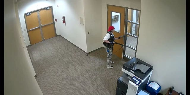 Covenant School shooter Audrey Hale opens the church office doors once inside the school building (1:07).