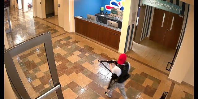 Covenant School shooter Audrey Hale walks past the Children's Ministry desk.