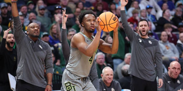 LJ Cryer, #4 of the Baylor Bears, attempts a three-point basket during the second half against the UC Santa Barbara Gauchos in the first round of the NCAA Men's Basketball Tournament at Ball Arena on March 17, 2023, in Denver, Colorado.