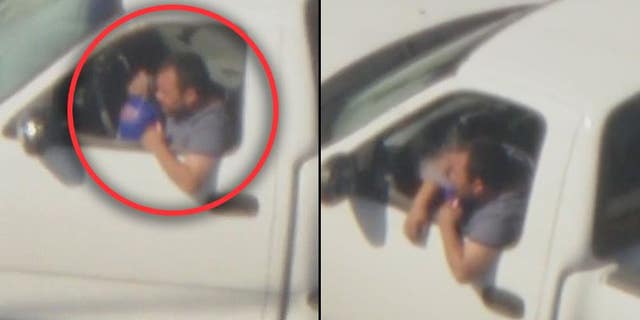 A DUI suspect is seen inhaling possibly helium from a balloon inside a truck during a police pursuit near Los Angeles on Thursday.