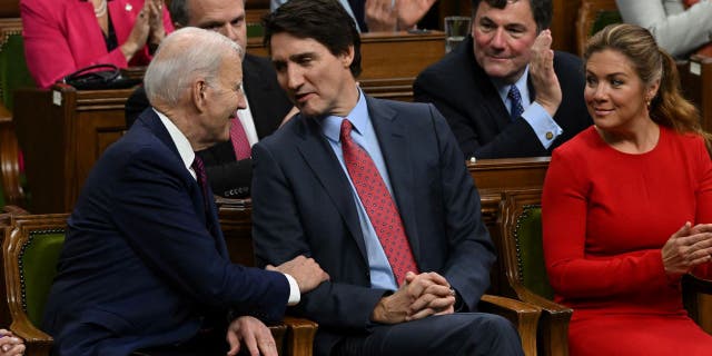 US President Joe Biden speaks with Canadian Prime Minister Justin Trudeau following his address to the Canadian Parliament in Ottawa, Ontario, Canada, on March 24, 2023.