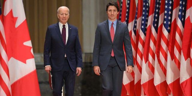 US President Joe Biden and Canada's Prime Minister Justin Trudeau arrive for a joint press conference at the Sir John A. Macdonald Building in Ottawa, Canada, on March 24, 2023. 