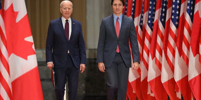 US President Joe Biden and Canada's Prime Minister Justin Trudeau arrive for a joint press conference at the Sir John A. Macdonald Building in Ottawa, Canada, on March 24, 2023. 