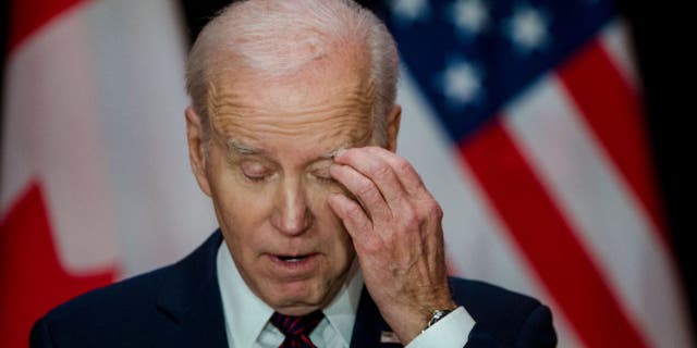 US President Joe Biden pauses during a joint press conference with Canada's Prime Minister Justin Trudeau at the Sir John A. Macdonald Building in Ottawa, Canada, on March 24, 2023.
