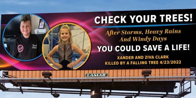 With the help of Lamar Advertising, Crystal and Brian Clark put up a billboard to urgently warn others about the dangers of falling trees.