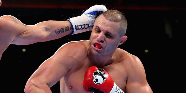 Tony Bellew of England punches a left hand to BJ Flores of USA in the WBC Cruiserweight Championship match during boxing at Echo Arena on October 15, 2016 in Liverpool, England.  
