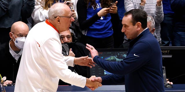 Syracuse coach Jim Boeheim, left, speaks with Duke coach Mike Krzyzewski after a game at Cameron Indoor Stadium in Durham, NC on January 22, 2022.