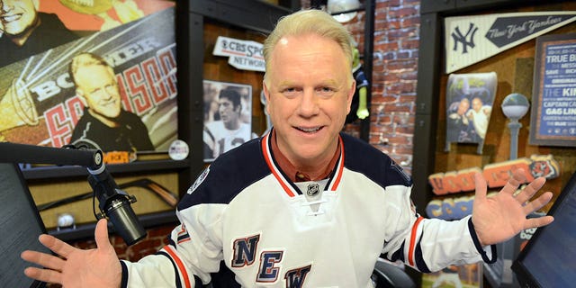 Boomer Eison wears a New York Rangers jersey on his radio show at the WFAN studios in New York.