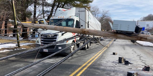 A driver was trapped under downed power lines in Stoneham, Massachusetts.