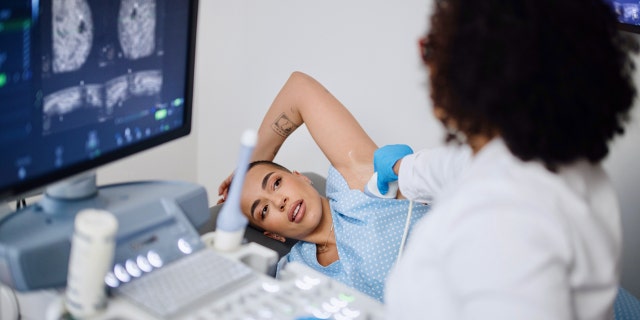 Woman getting mammogram