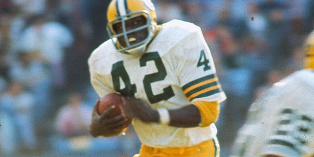 John Brockington of the Green Bay Packers carries the ball during a game against the Baltimore Colts at Memorial Stadium in Baltimore on Sept. 22, 1974.