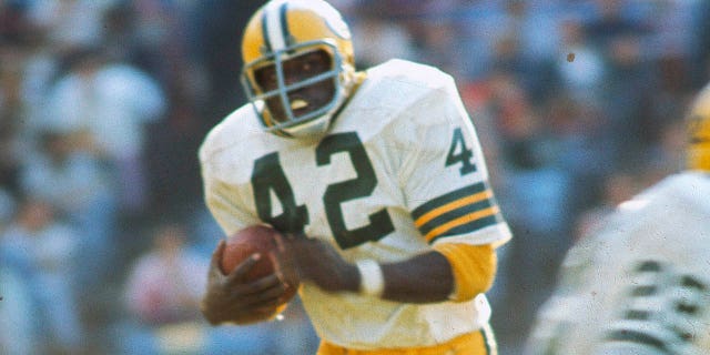 John Brockington of the Green Bay Packers carries the ball during a game against the Baltimore Colts at Memorial Stadium in Baltimore on Sept. 22, 1974.