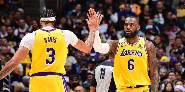 LeBron James (6) and Anthony Davis (3) of the Los Angeles Lakers celebrate during a game against the Portland Trail Blazers Nov. 30, 2022, at Crypto.Com Arena in Los Angeles. 