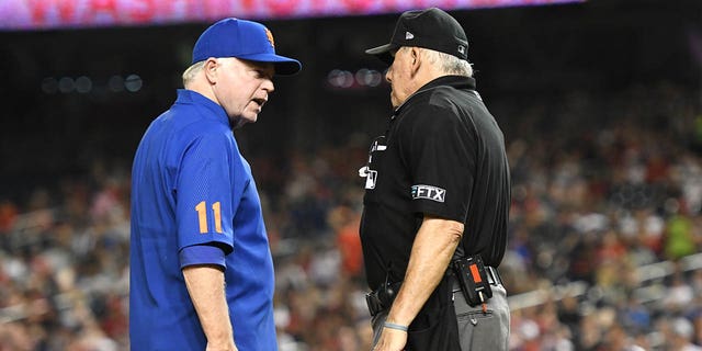 Manager Buck Showalter of the New York Mets argues a call with umpire Larry Vanover during a game against the Washington Nationals at Nationals Park Aug. 1, 2022, in Washington, D.C.  