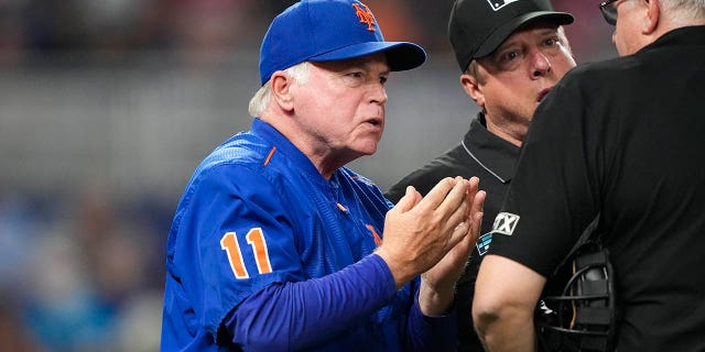 Manager Buck Showalter of the New York Mets talks with location sheet umpire Paul Emmel bout a telephone during the seventh inning against the Miami Marlins June 24, 2022, successful Miami, Fla.