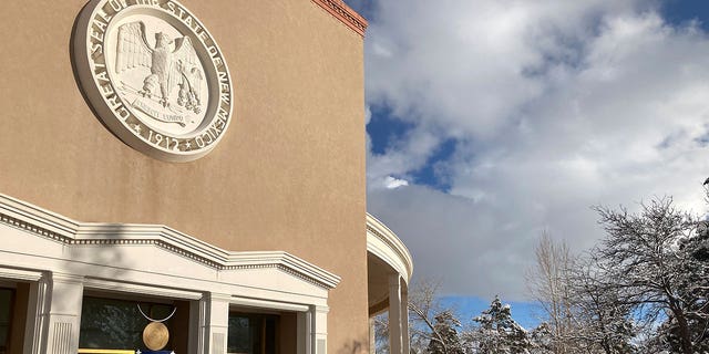 The New Mexico state Capitol building is seen during winter on Feb. 15, 2023, in Santa Fe. State legislators are weighing on a package that would provide financial relief to veterans, electric vehicle buyers, and families with young kids.