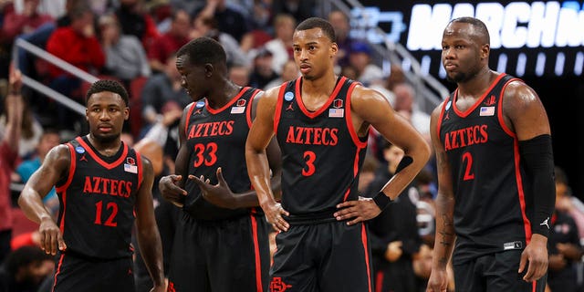 Players of the San Diego State Aztecs stand court against the Alabama Crimson Tide during the Sweet Sixteen round of the 2022 NCAA Men's Basketball Tournament held at KFC YUM!  Center on March 24, 2023 in Louisville, Kentucky. 