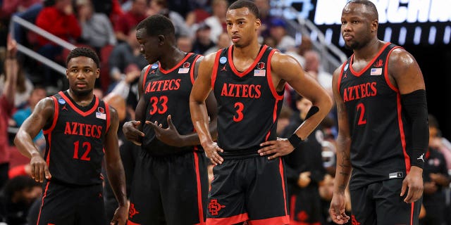 San Diego State Aztecs players on the court against the Alabama Crimson Tide during the Sweet 16 of the 2022 NCAA Tournament at KFC YUM! Center March 24, 2023, in Louisville, Ky.
