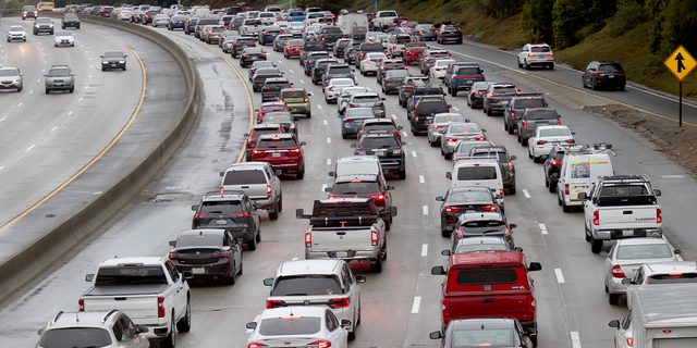 Traffic backs up on Interstate 580 eastbound at Keller Avenue in Oakland, California, Friday, March 10, 2023. The freeway was closed between High Street and 35th Avenue due to flooding.