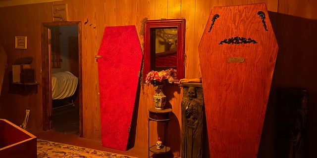 The casket doors serve as an entry way to extra storage space in the home.