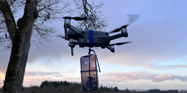 In this photo reenactment, Lane County Sheriff’s Office showed the motorists ingenuity by taking his iPhone and tying it to his drone.