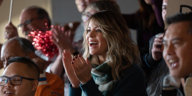 Kaitlin Olson stars as Harrelson's love interest, Alex.
