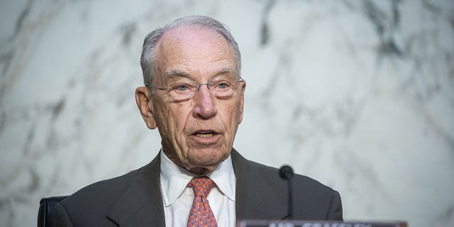 Sen.  Chuck Grassley speaks into microphone during hearing