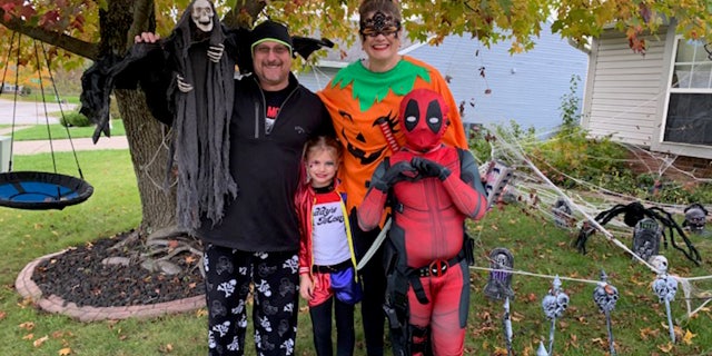 Crystal and Brian Clark are seen in Halloween costumes with their late children, Ziva (front left) and Xander (front right).