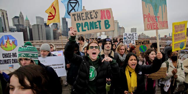 Democrats turn climate change into the next mental health crisis 2 People walk through the Brooklyn Bridge during a strike for climate on March 03, 2023 in New York City. Protesters demand New York State support found and pass the Climate Jobs, and Justice Package. (Photo by Leonardo Munoz/VIEWpress/Corbis via Getty Images)