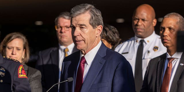 North Carolina Gov. Roy Cooper speaks on Oct. 14, 2022. The North Carolina General Assembly gave final approval Tuesday to pass a legislation designed to help hotels remove longer-term guests. The measure will now head to Gov. Roy Cooper.