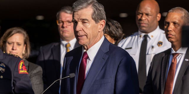 North Carolina Gov. Roy Cooper speaks on Oct. 14, 2022. The North Carolina General Assembly gave final approval Tuesday to pass a legislation designed to help hotels remove longer-term guests. The measure will now head to Gov. Roy Cooper.