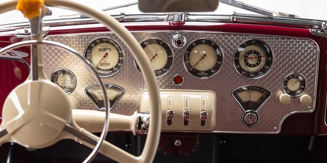 The car has an engine-turned metal dashboard.